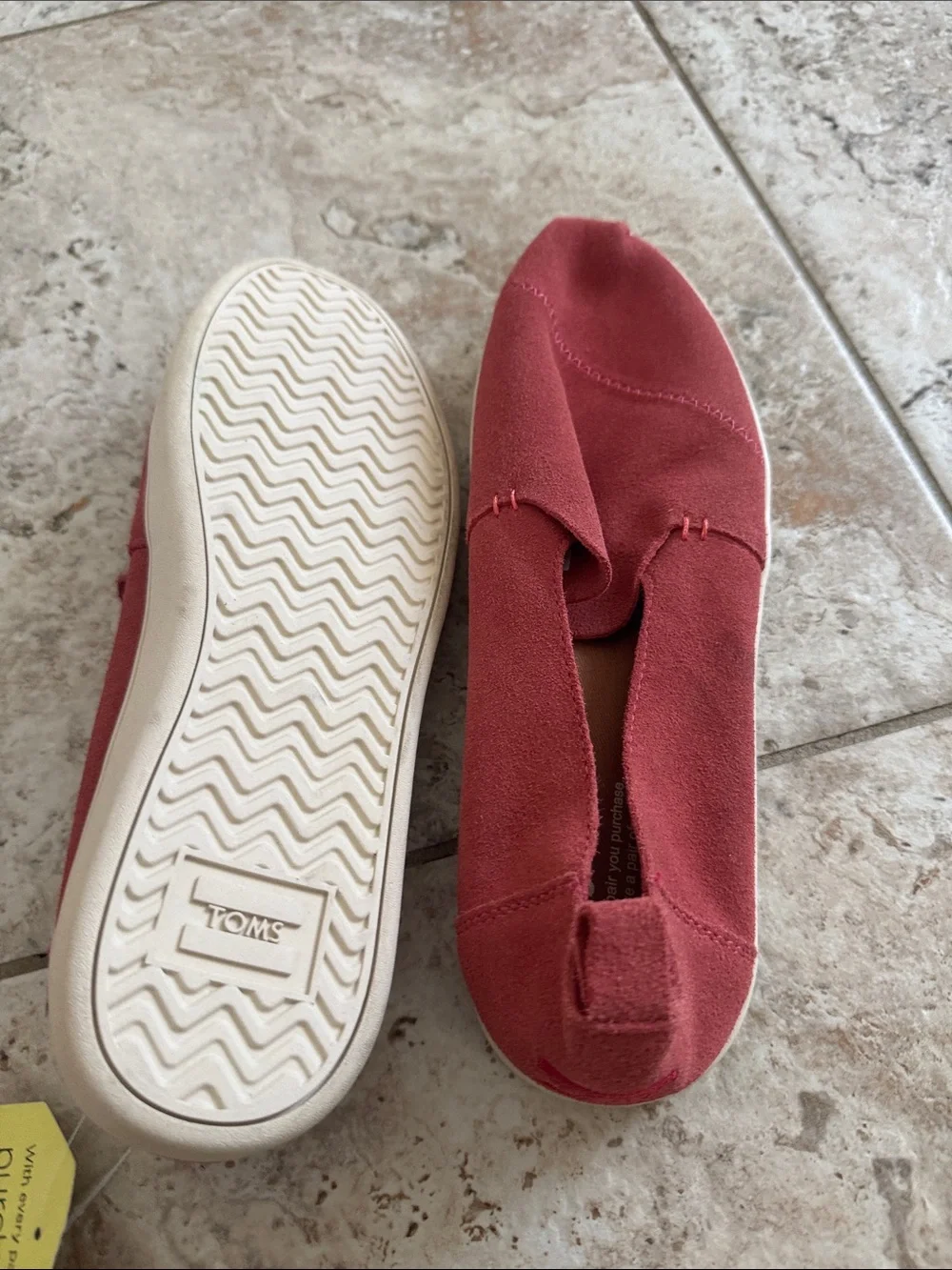 TOMS Women's Slip on sneaker style in Rust colored Red Suede